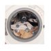 Laundry dryer with White Magic Eco Basics balls amidst towels, showcasing efficient drying and fabric softening.