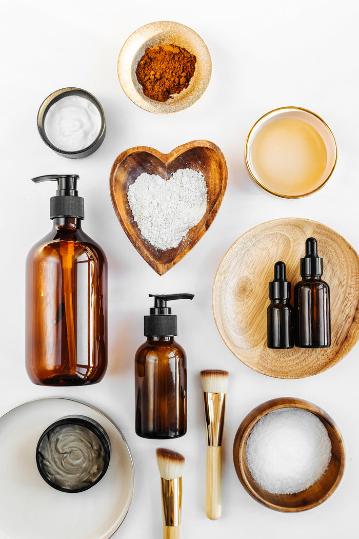 Natural skincare ingredients in bowls on a white table