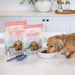 Dog eating Air Proudi beef food; 400g and 1kg packs shown for context