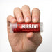 Hurraw Black Cherry 4.8g lip balm shown in hand