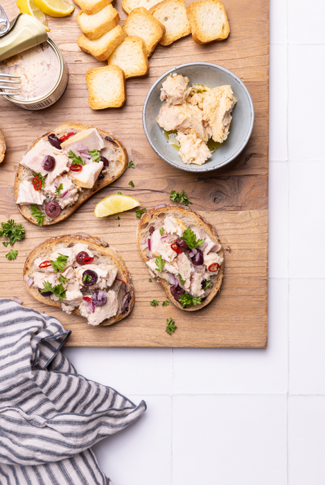 East Coast Tuna Co serving suggestion: tuna on sourdough with olives and lemon; other ingredients not included