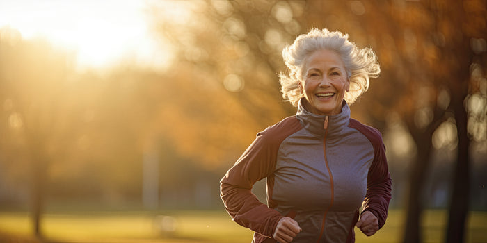 An older woman jogging in a park, staying active